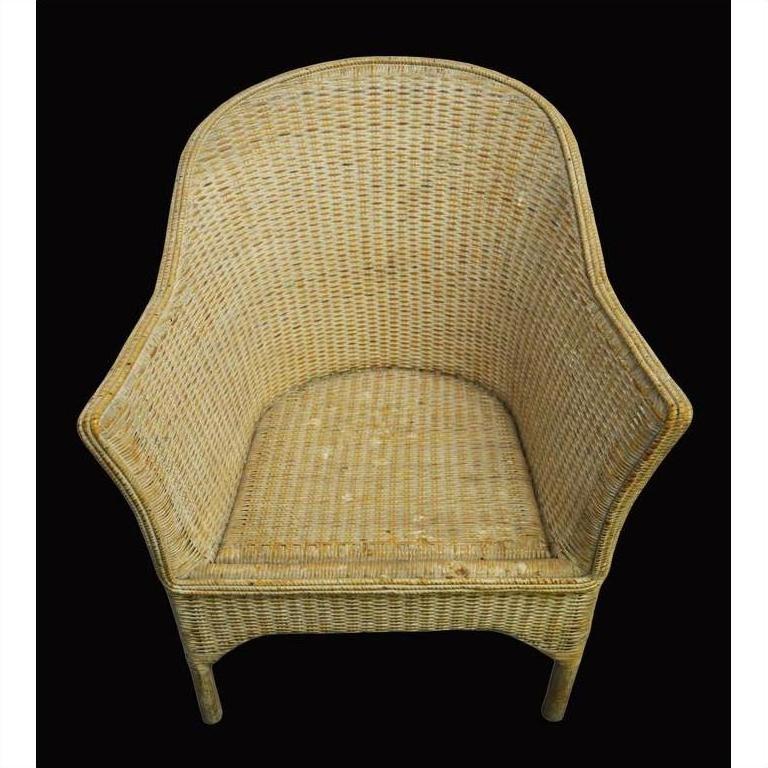Natural rattan Burmese chair with curved back and sides on solid black background.