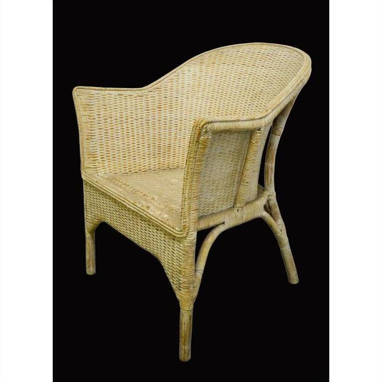 Brown rattan Burmese chair with curved back and woven seat, close-up against a black background.
