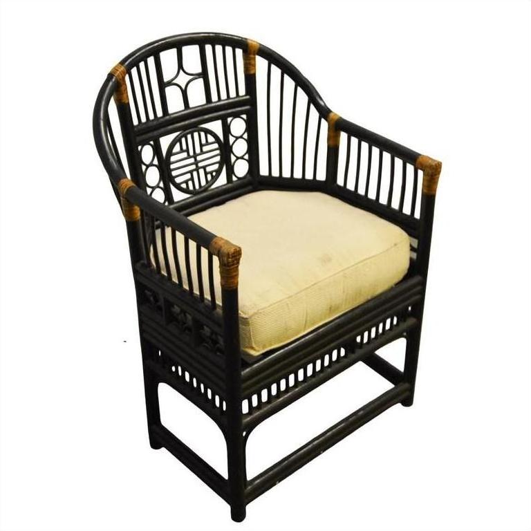 Black rattan side chair with decorative backrest and white cushioned seat, close-up view.