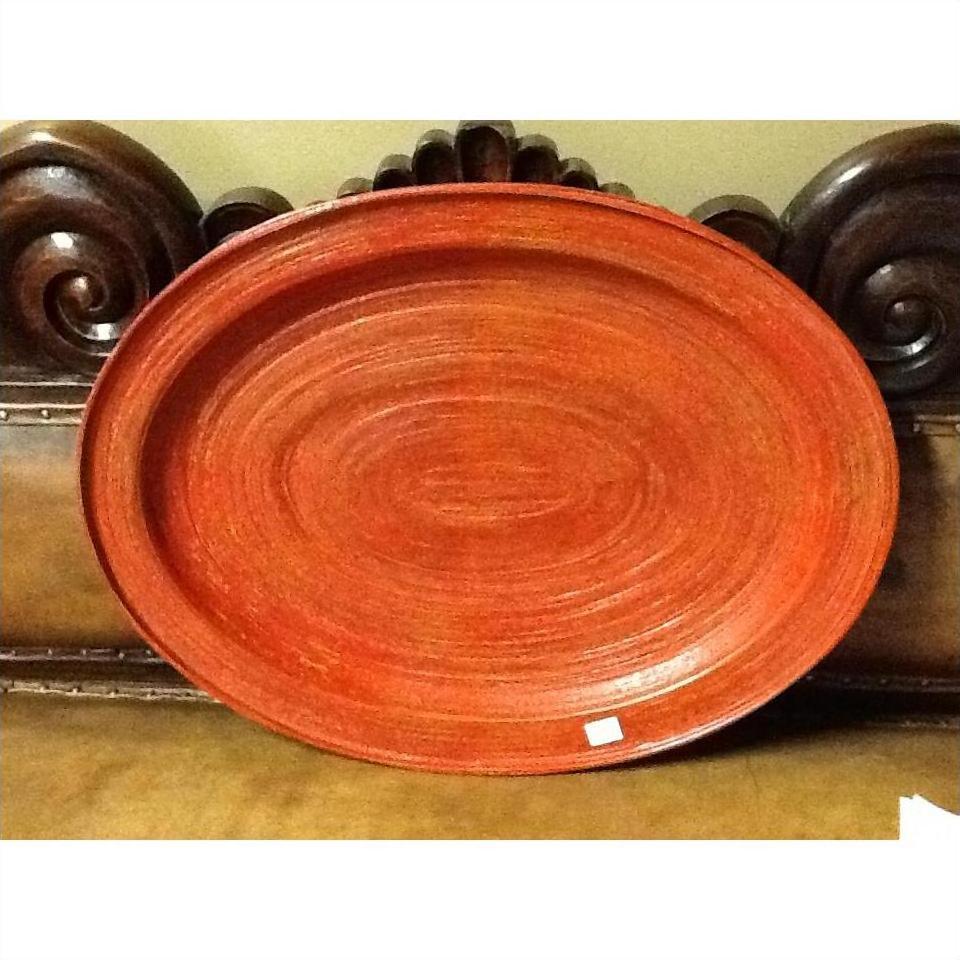 Reddish-brown oval Burmese tray, wood finish, assorted sizes, displayed on ornate dark wood surface.