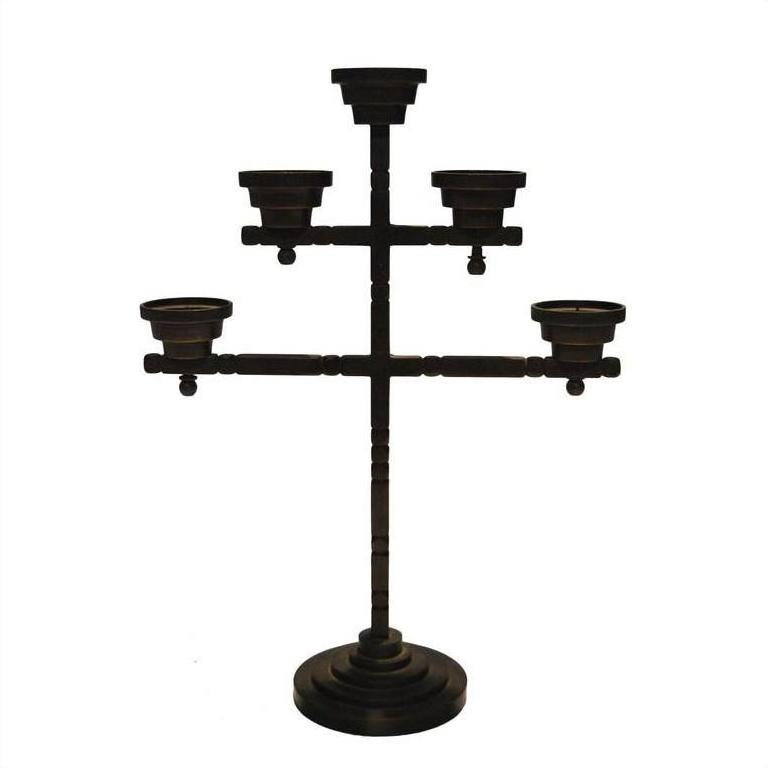 Black metal candelabra with five candle holders and round base, close-up, ideal for home décor.