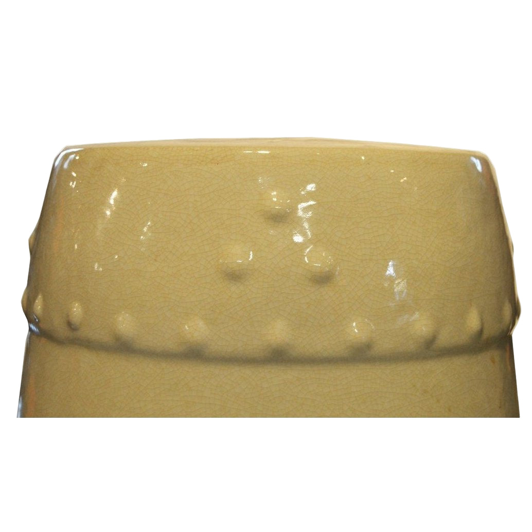 Celadon porcelain garden seat with beaded raised dots and textured rim on a white background.