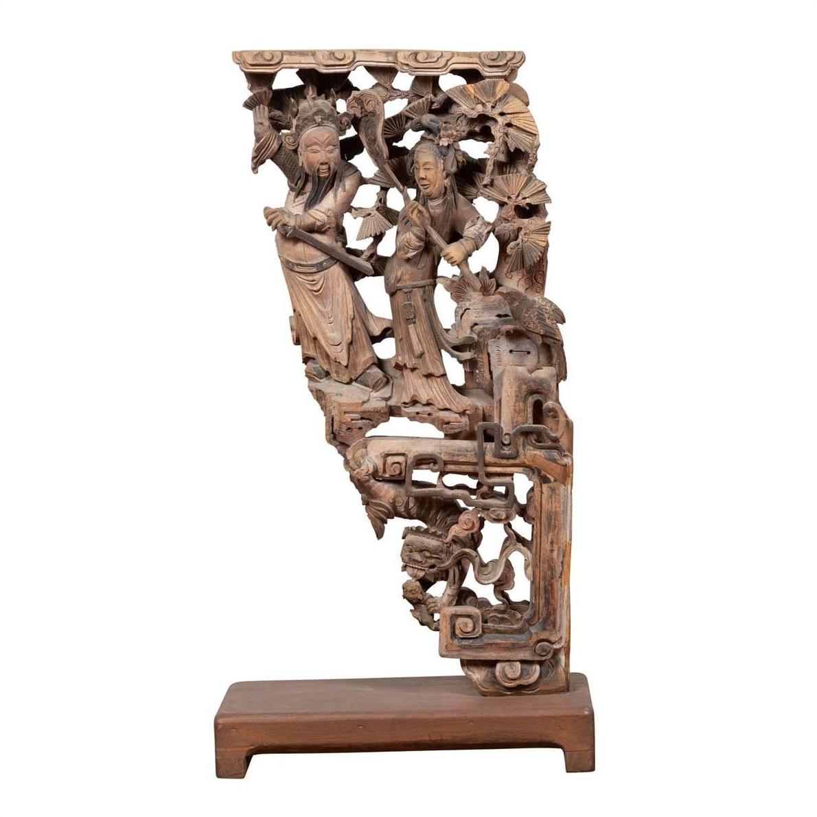 Brown wood hand-carved corbel with deities and ornate base, Chinese antique from 1900s, close-up view.