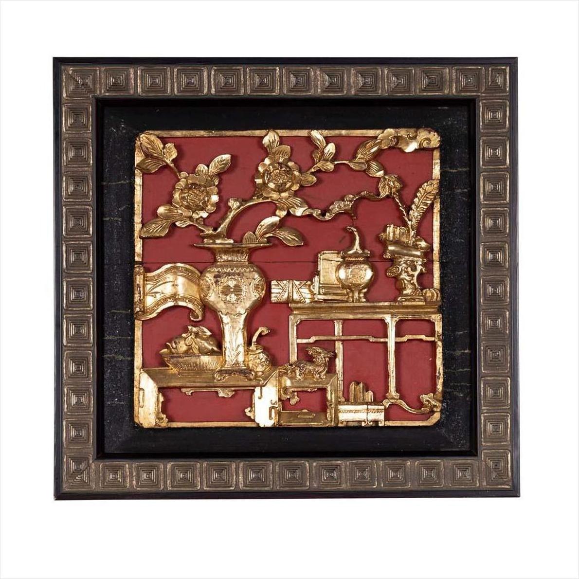 Close-up of red giltwood Chinese floral architectural panel in decorative black and bronze square frame.
