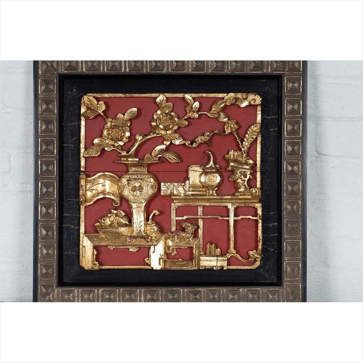 Close-up of red giltwood Chinese antique architectural panel featuring floral and vase motifs in a decorative frame.