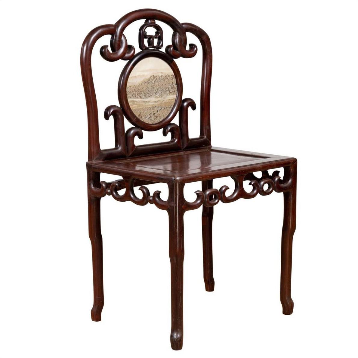 Dark rosewood Chinese side chair with open fretwork and round marble medallion back panel, studio view.