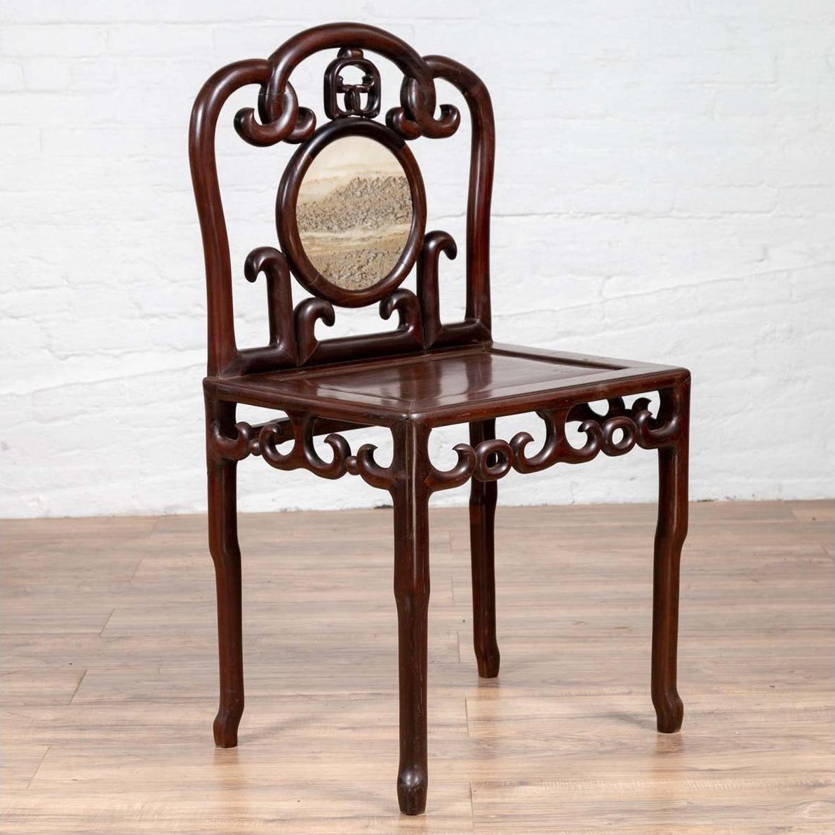 Dark rosewood Chinese antique side chair with marble medallion and open fretwork, shown on a wooden floor.
