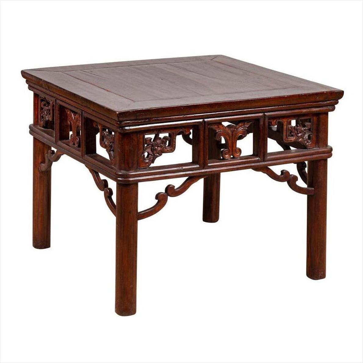 Dark wood Chinese antique side table with open fretwork design, traditional square style, close-up view.