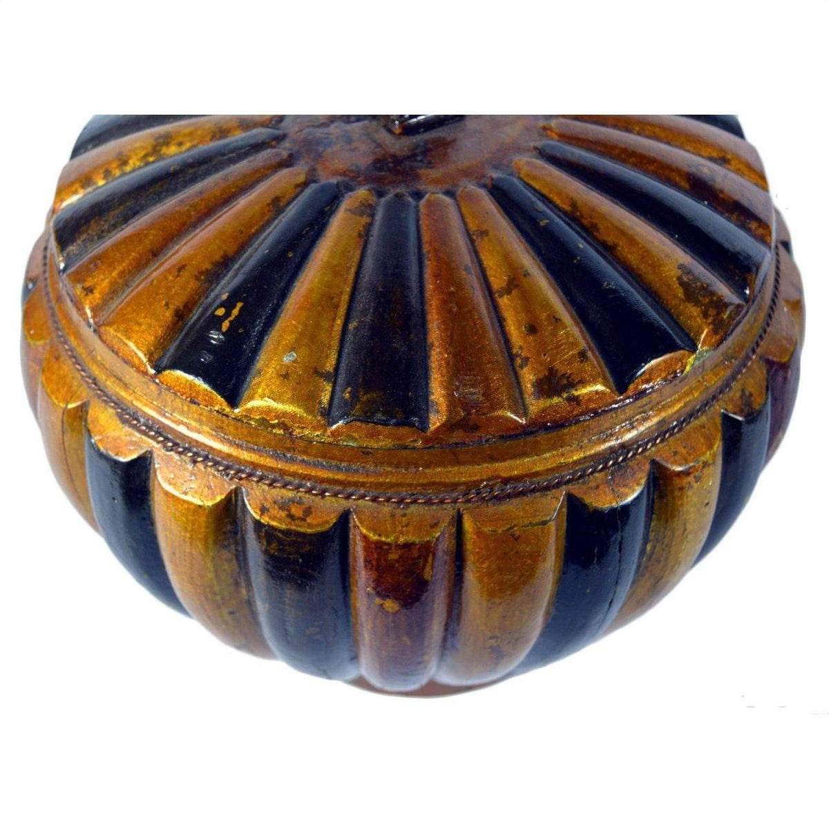 Close-up of a round bamboo rice basket with ribbed gold and black body, scalloped design, and metallic finish.