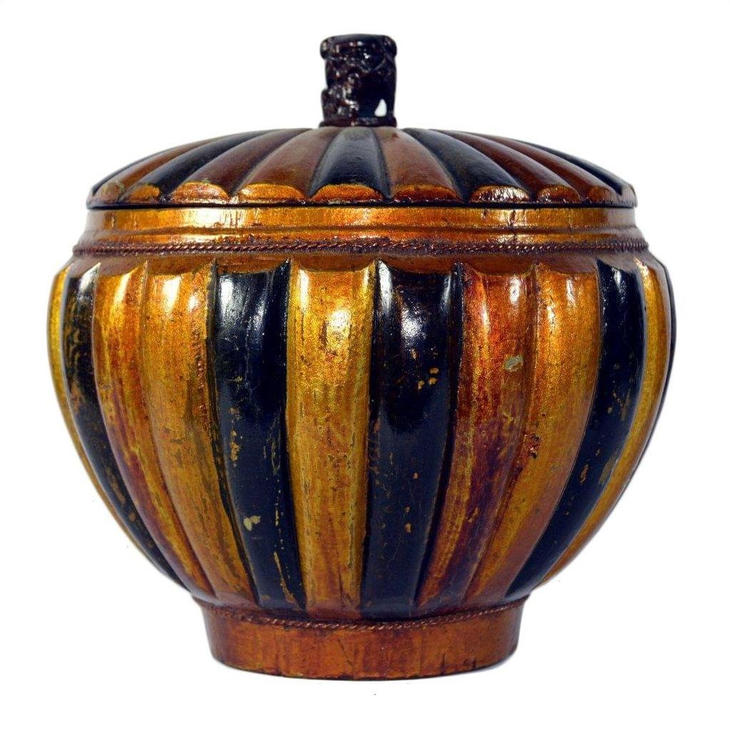 Close-up of a round Chinese bamboo rice basket with gold and black stripes and a small ornate top handle.
