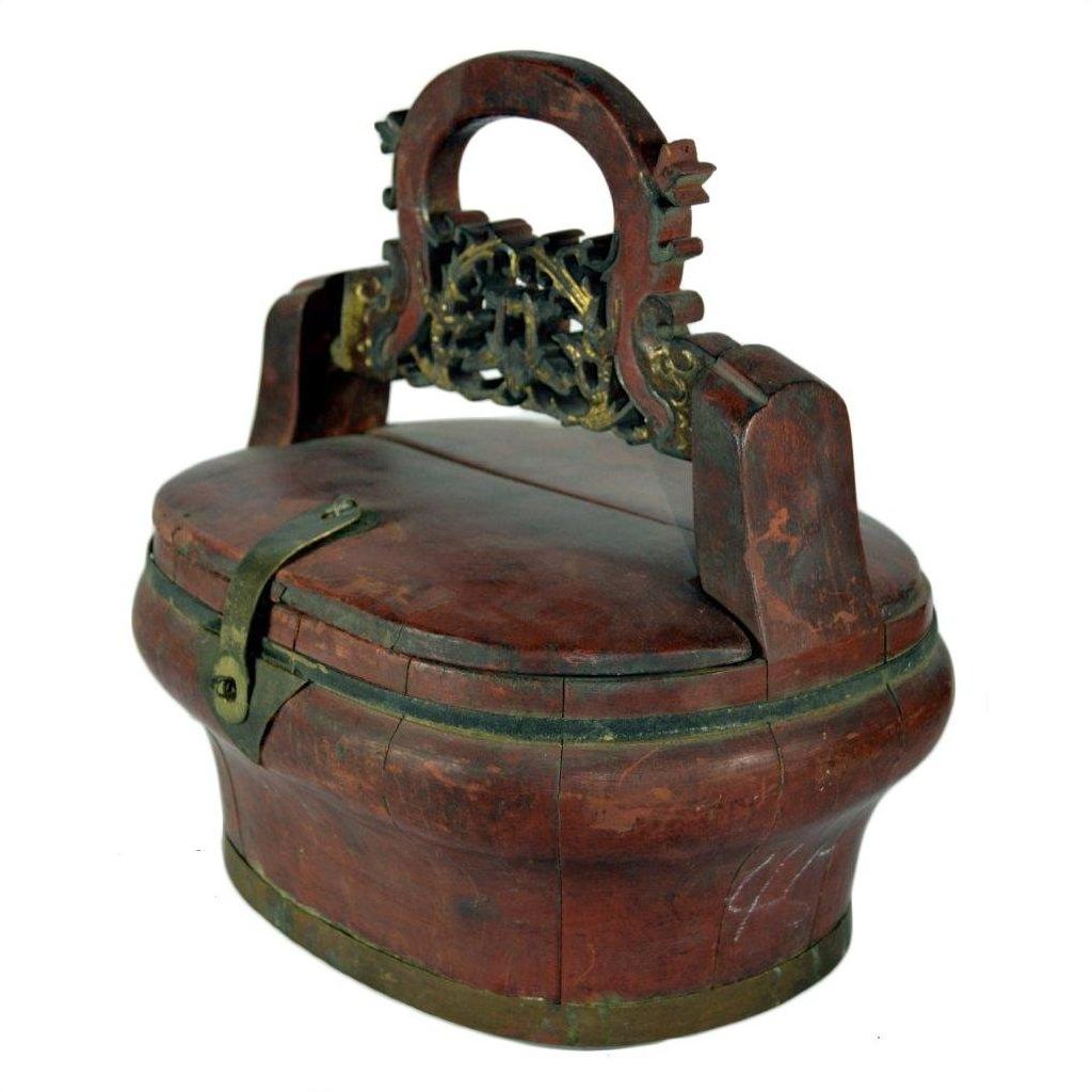 Brown bamboo wedding basket with curved lid and decorative handle, close-up view, in good condition.
