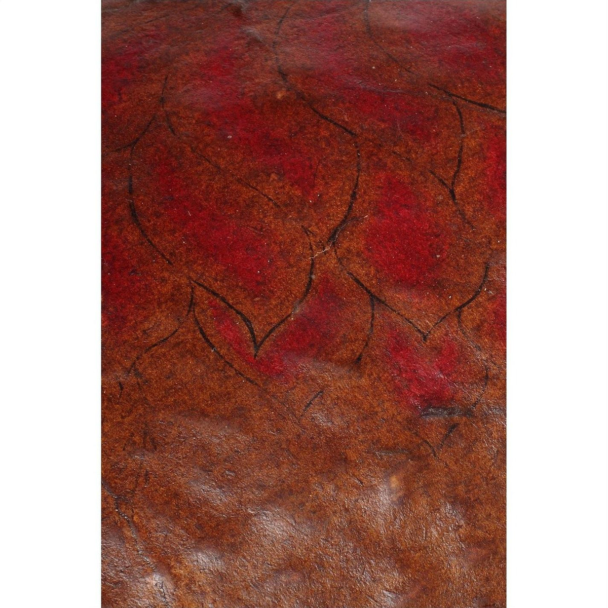 Close-up of a brown and red textured Chinese basket with abstract leaf-like patterns on the surface.