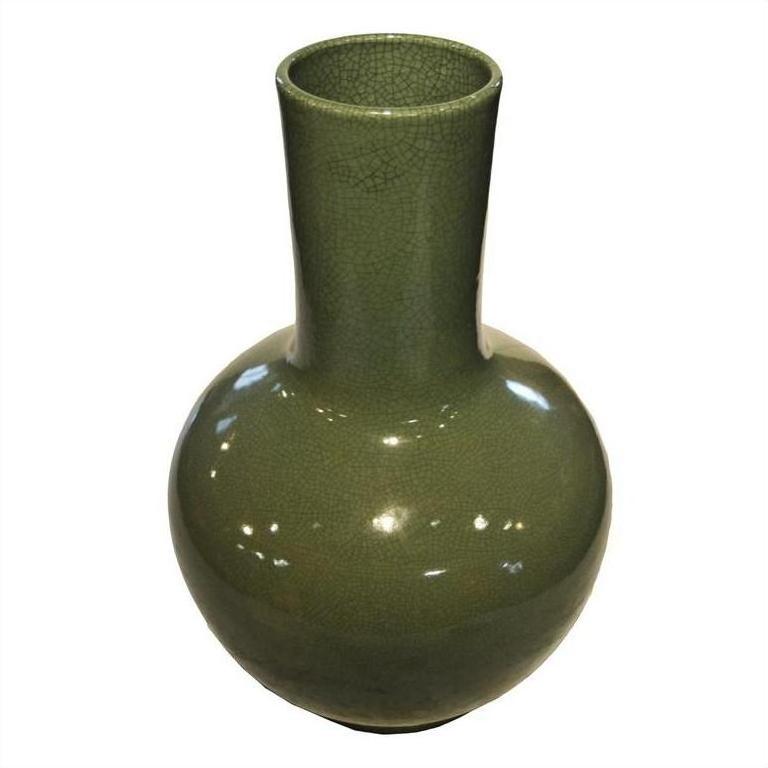 White crackle celadon porcelain vase with round body and long narrow neck, close-up on white background.