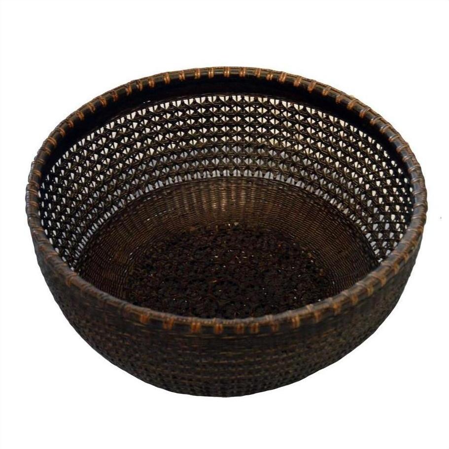 Brown lacquered bamboo basket with round shape, open lattice design, and solid base on white background.