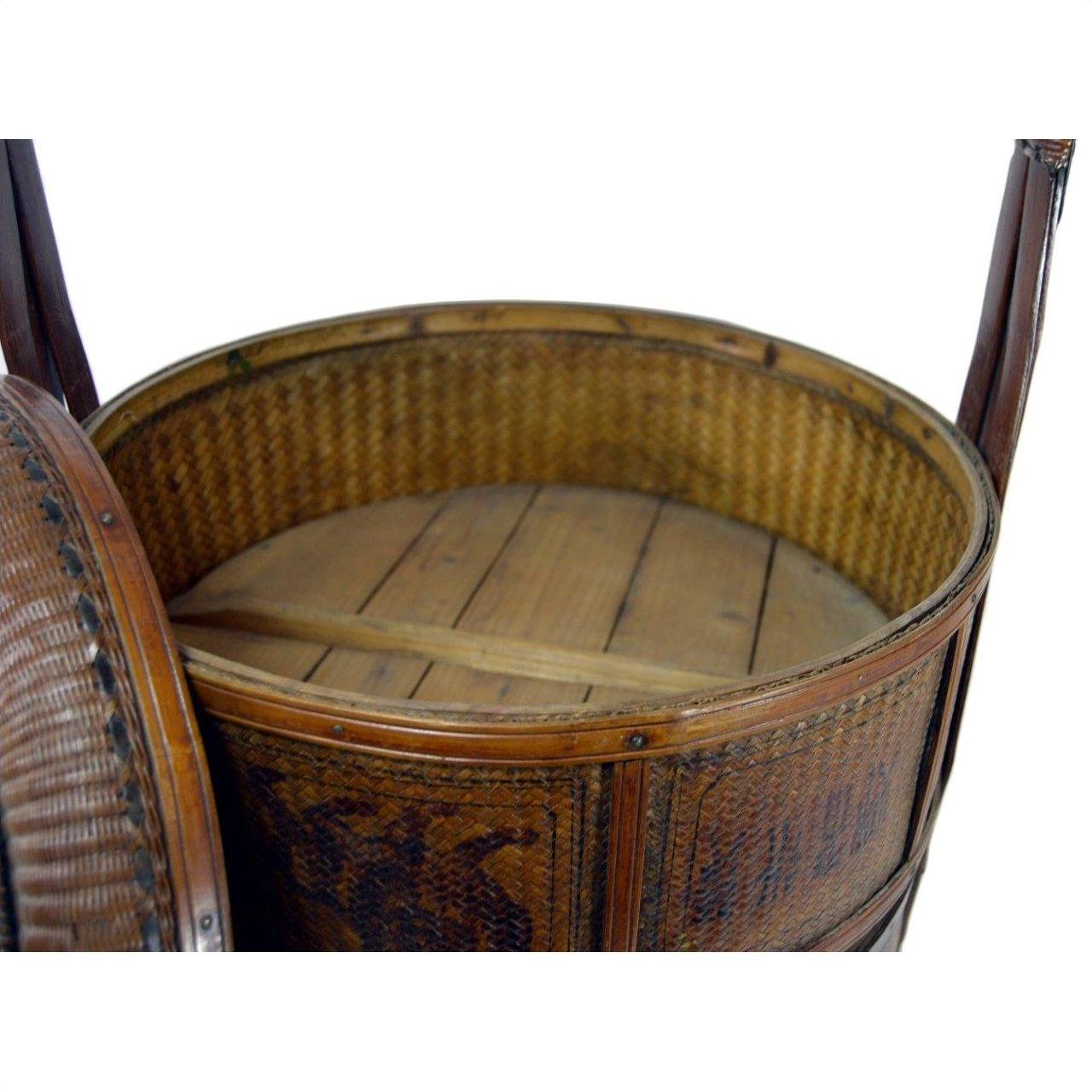 Brown wooden Chinese large wedding basket with lid, two upright handles, and sturdy base, close-up view.