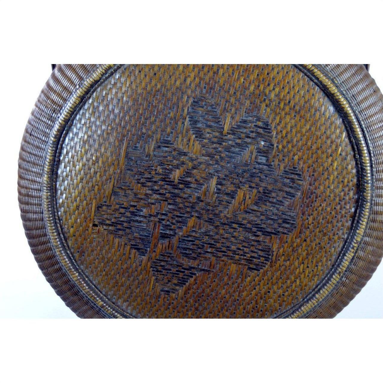 Brown Chinese large wedding basket lid with dark character pattern, close-up of lid in good condition.