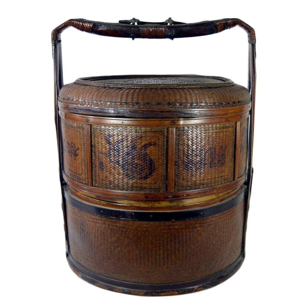 Large brown Chinese wedding basket with lid and handle, decorative sides, woven material, close-up view.