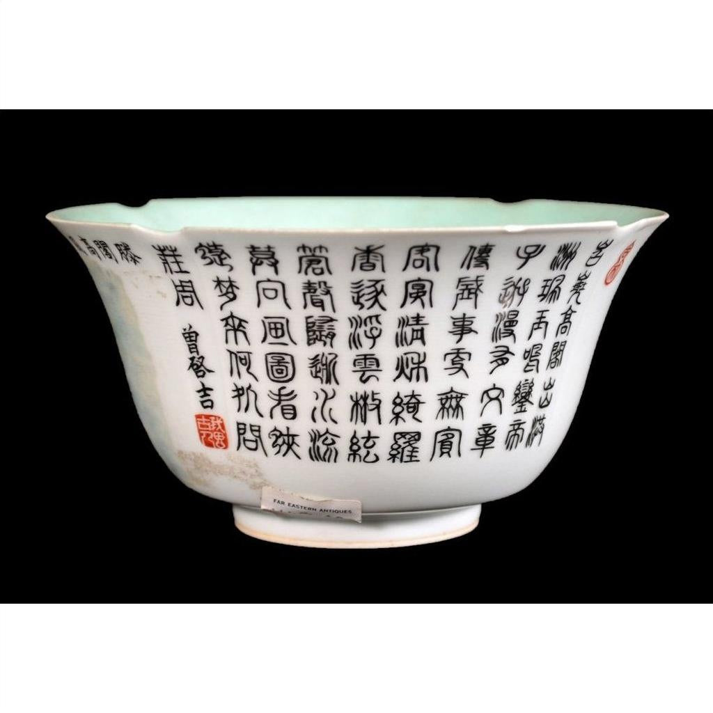 White porcelain bowl with black calligraphy and a red seal, set against a black background, close-up.