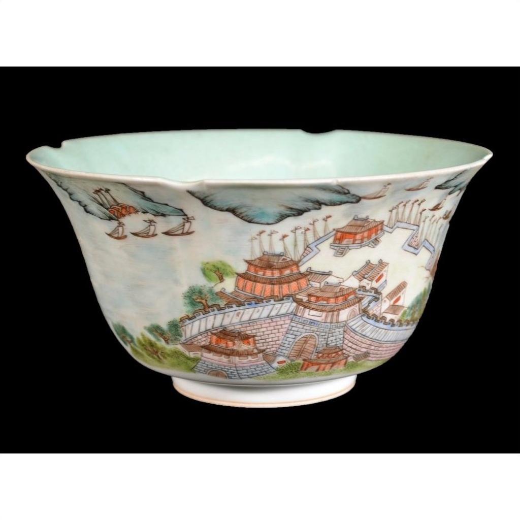 Close-up of a red, green, and blue Chinese Mankok porcelain bowl with ancient architecture and landscape designs.