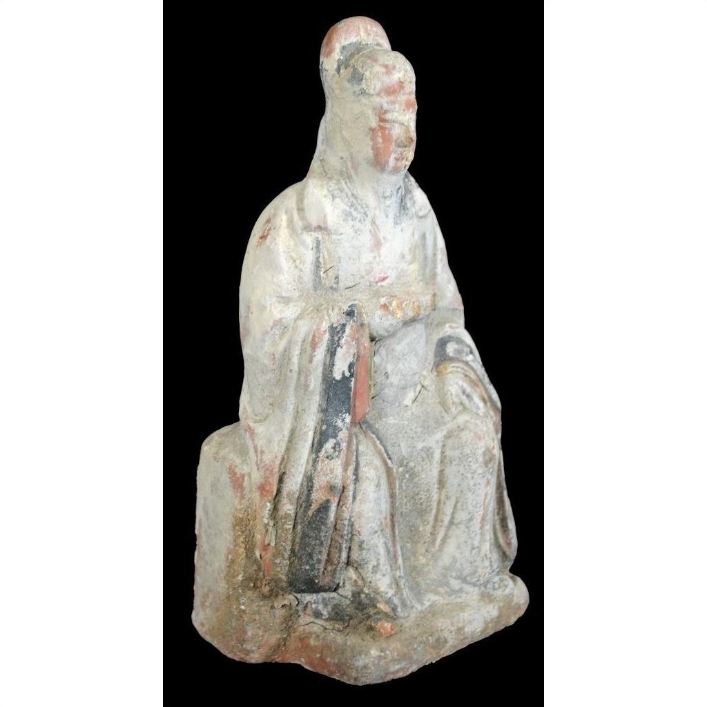 Terracotta Ming Dynasty court figure statuette in faded robes and headdress on black background, 17th century.