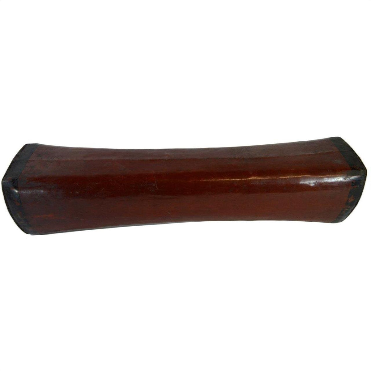 Dark brown wooden antique opium pillow with curved rectangular shape and gently rounded sides, close-up view.