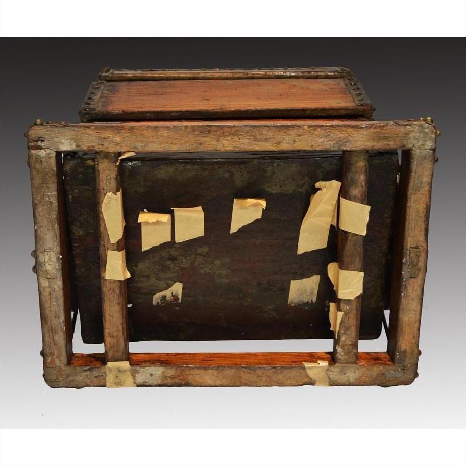 Brown and beige wooden Chinese picnic box, reinforced with masking tape and wooden supports, bottom view.