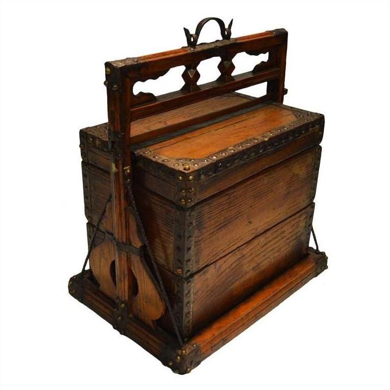 Vintage wooden Chinese picnic box writing desk with metal accents, compartments, and handles on display.