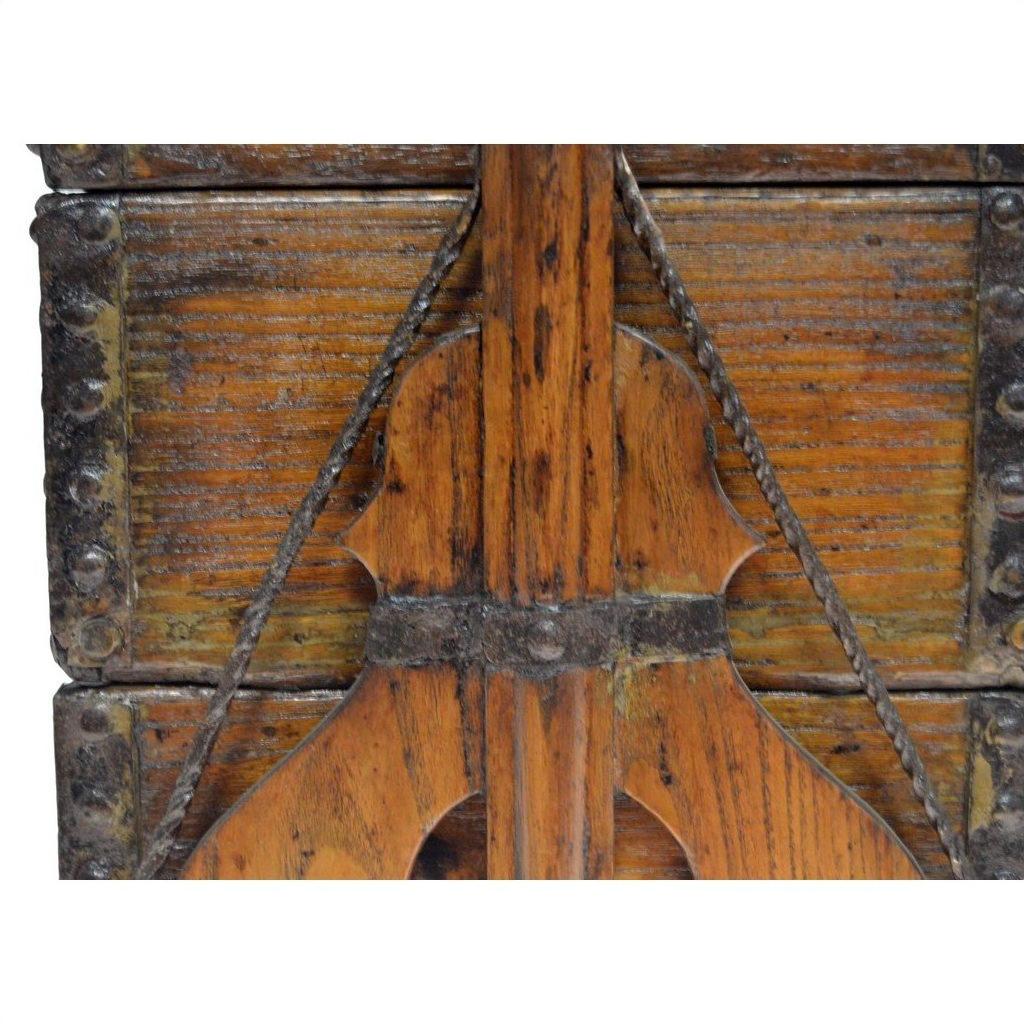 Close-up of a brown wooden Chinese picnic box with metal accents and carved details, showing aged patina.