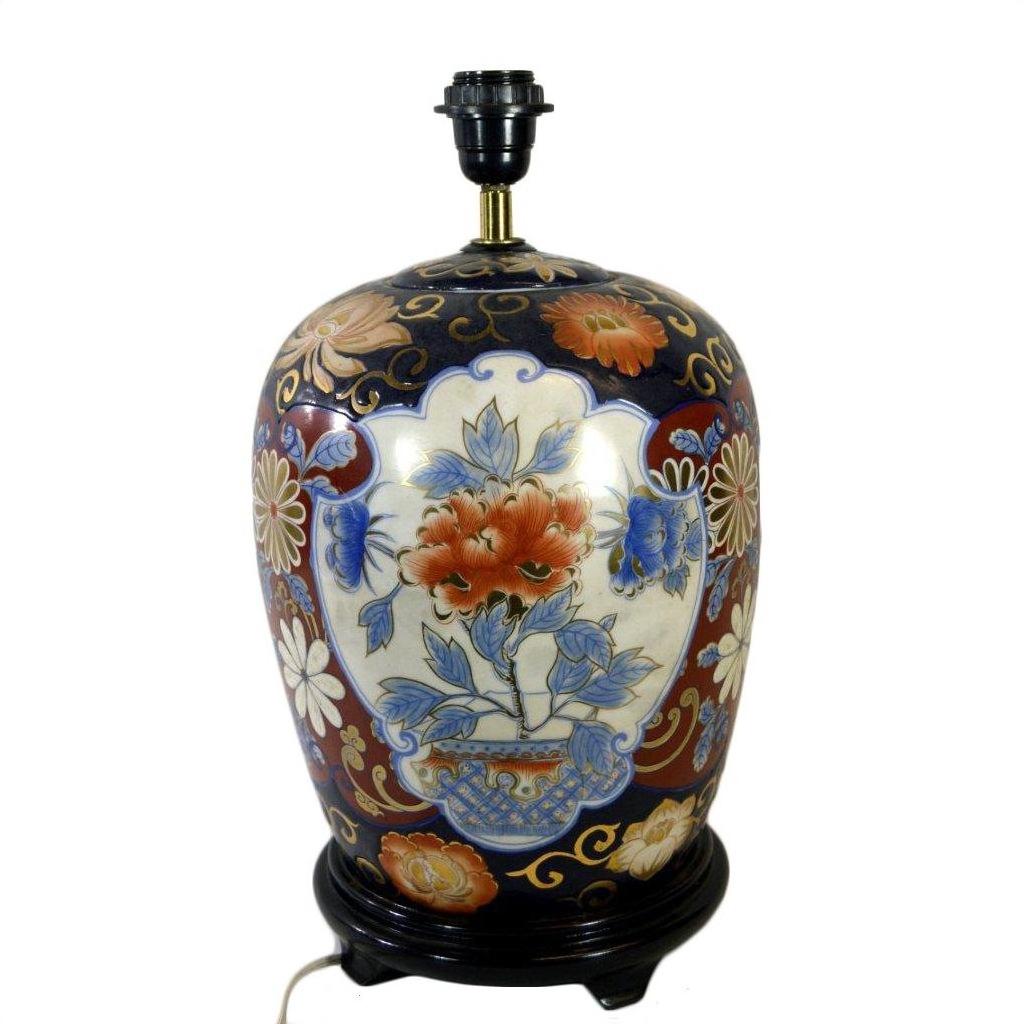 Red, blue, and gold floral Chinese porcelain electric lamp on black stand, shown in good condition.
