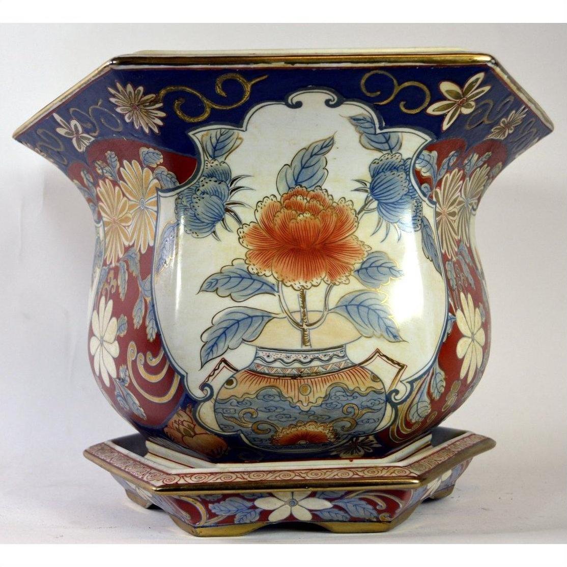 Multicolor Chinese porcelain planter with hand-painted floral patterns and large central flower, close-up view.