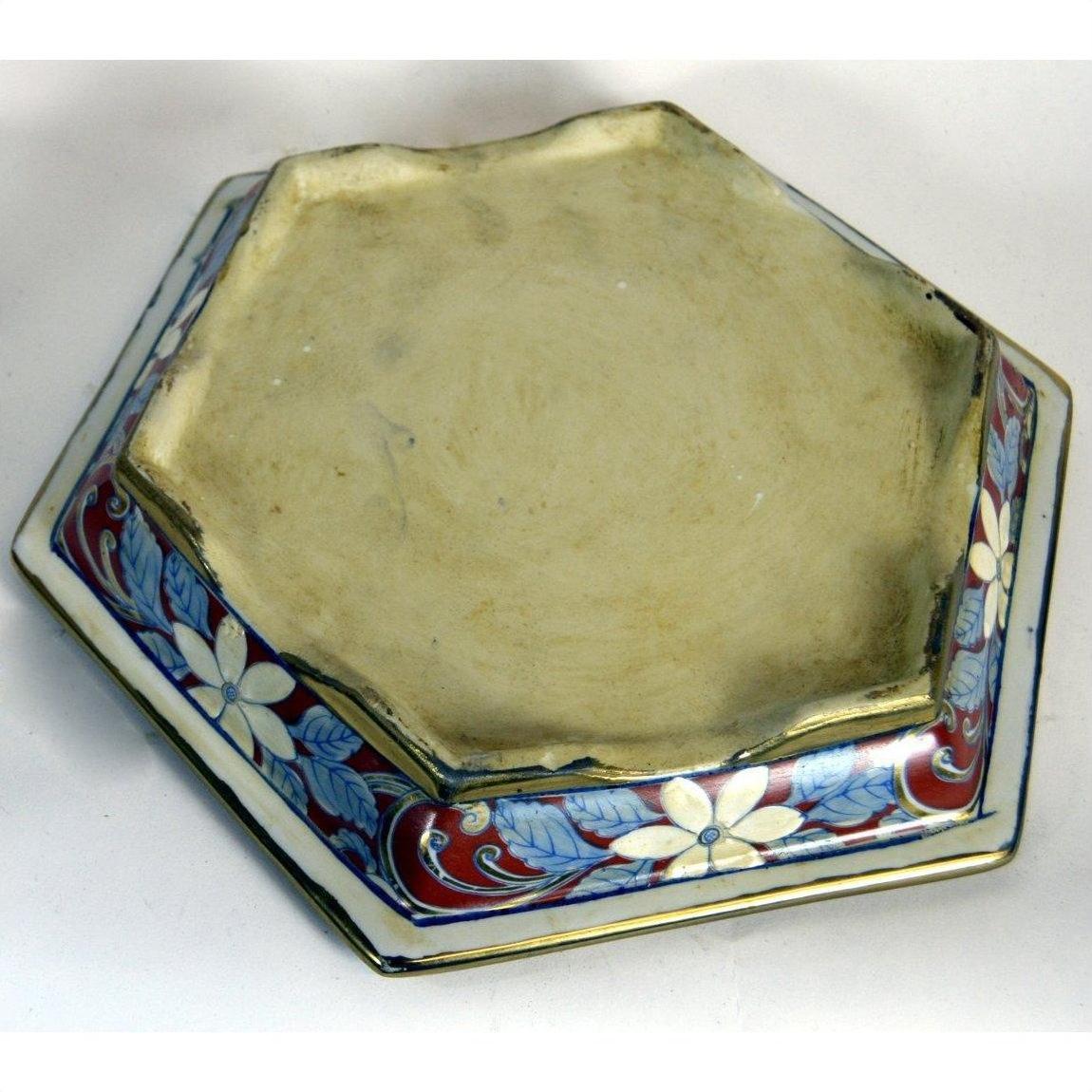 Multicolor porcelain planter with hand-painted floral and leaf patterns, plain beige center.