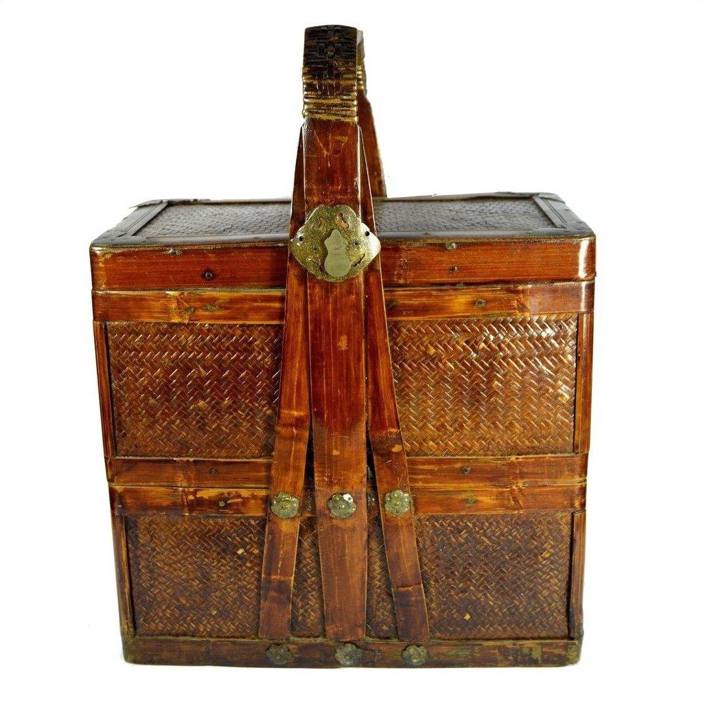 Brown woven bamboo rectangular basket with handle, metal latch, and top cover, Shandong style wedding box.