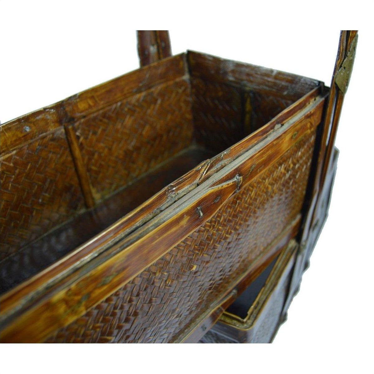 Close-up of a rectangular Chinese wedding box with brown wooden frame, rattan weave, and hinged lid.