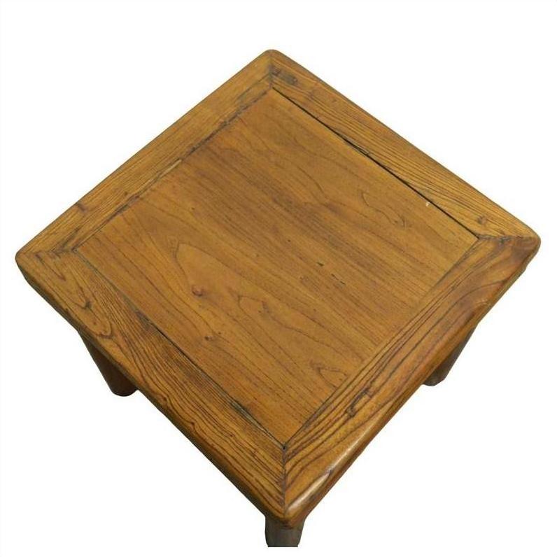 Brown wood Chinese side table with simple design and visible grain, square shape, top view.