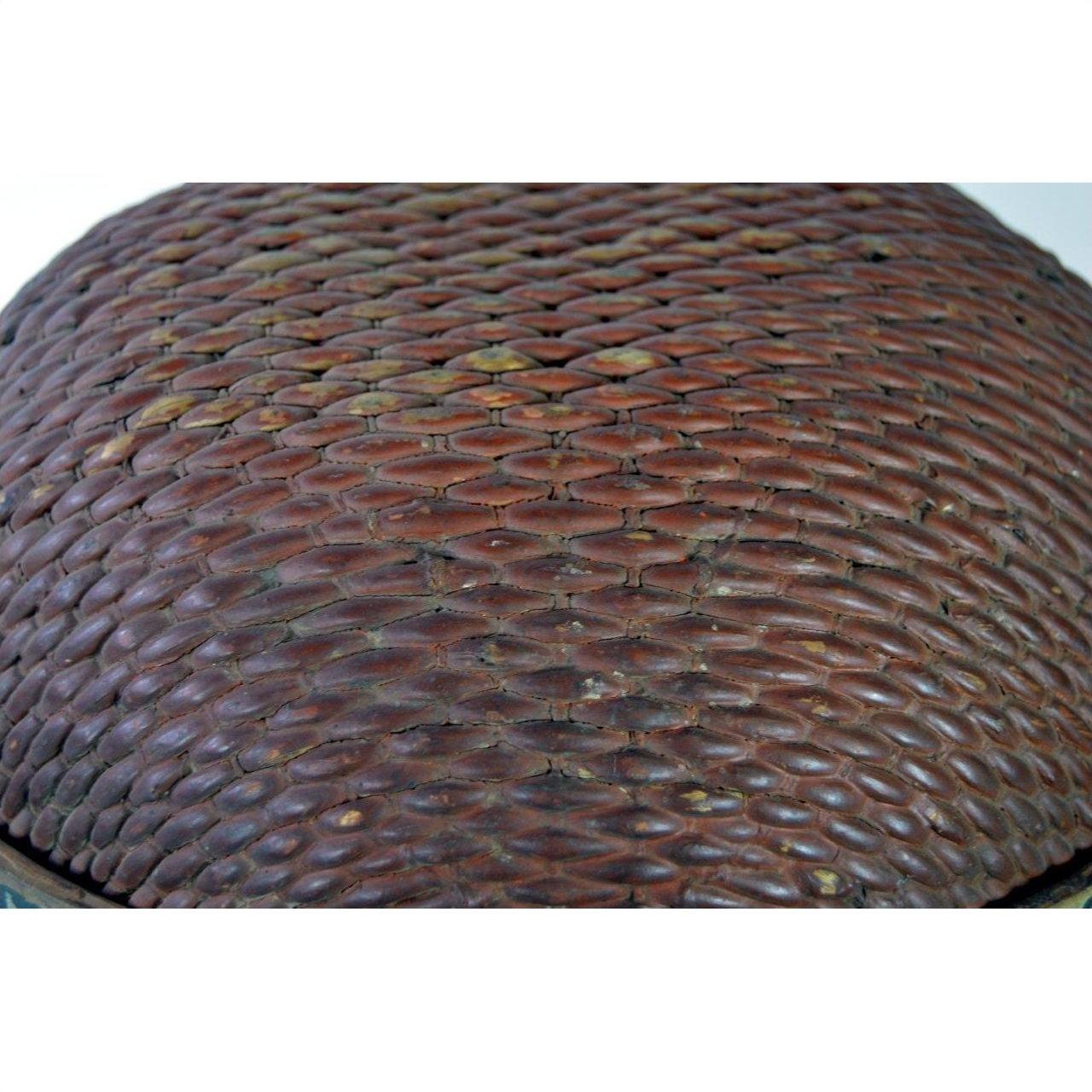 Close-up of brown woven texture with diamond pattern on Chinese storage basket.
