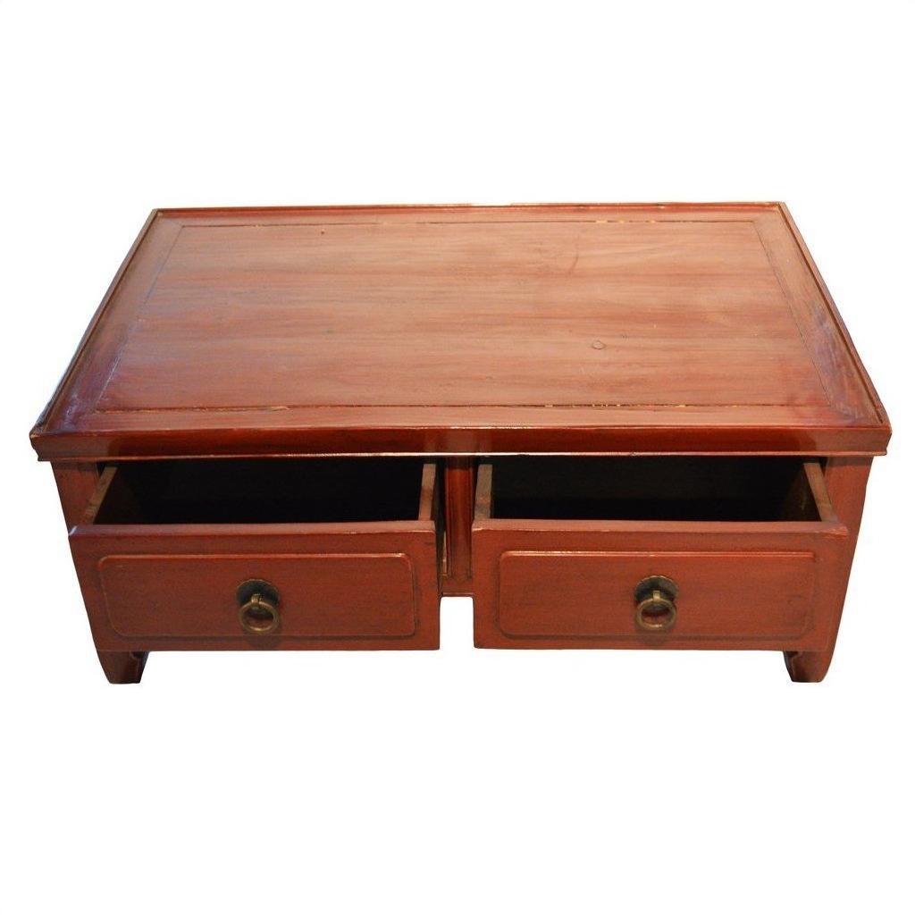 Reddish-brown wood Chinese Low Kang coffee table with two open drawers and round metal handles, front view.