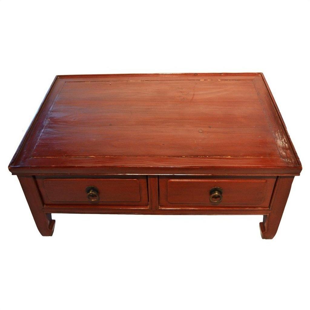 Reddish wood Chinese low Kang coffee table with two front drawers and round metal handles, front view.