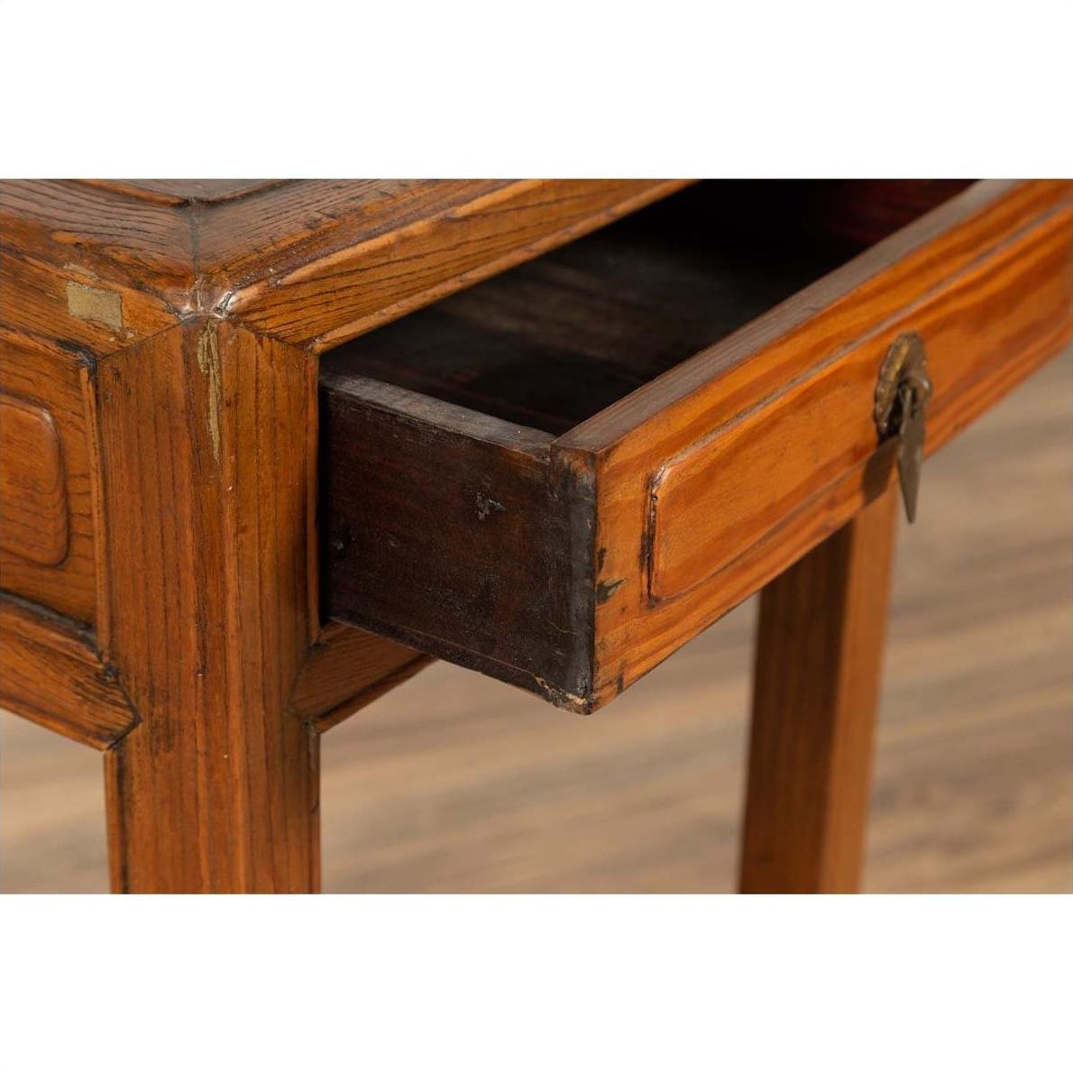 Close-up of brown elmwood table with open single drawer and cracked ice shelf, vintage Chinese style.