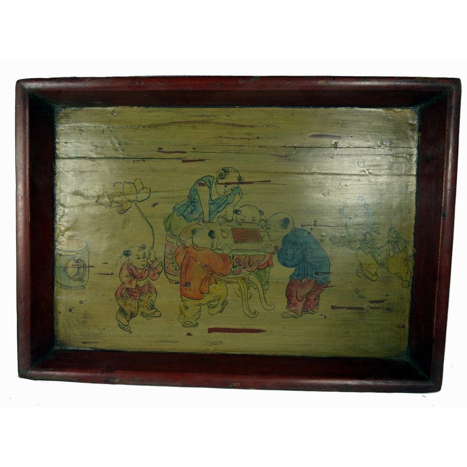 Yellow wooden tray, hand-painted with children, used condition, close-up.
