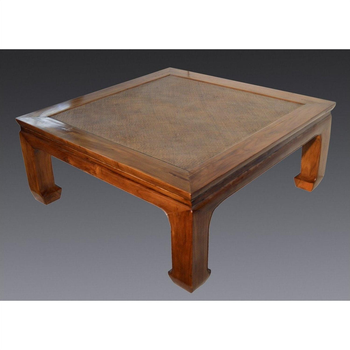 Light lacquered wood square coffee table with raised edge and sturdy curved legs, studio view.