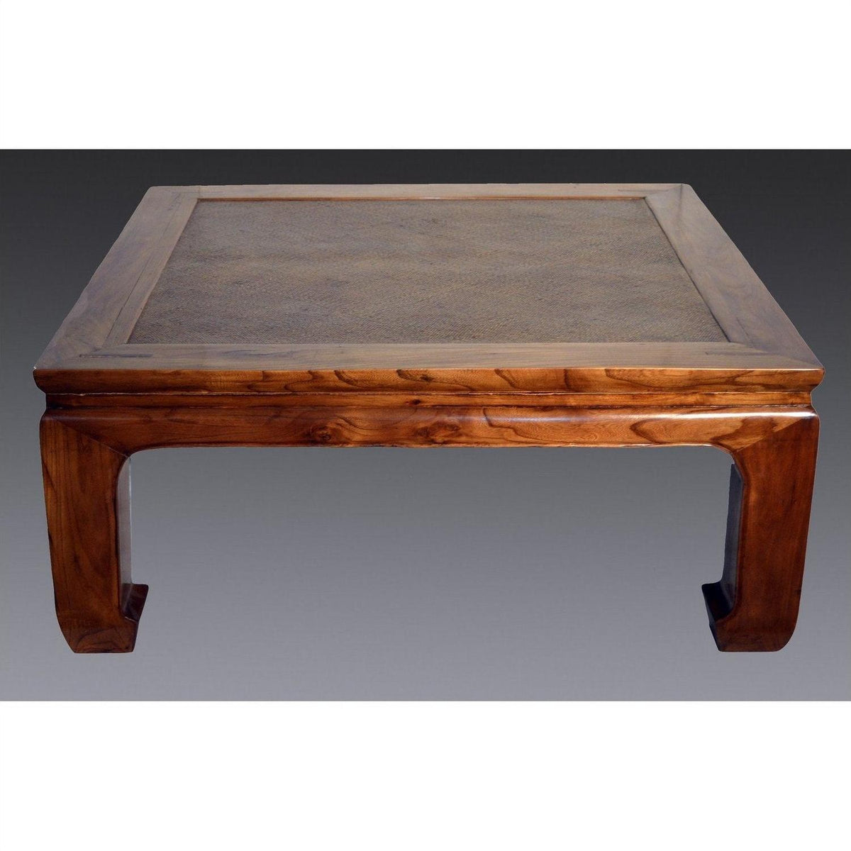 Brown lacquered coffee table with curved legs, set against a neutral gradient background.