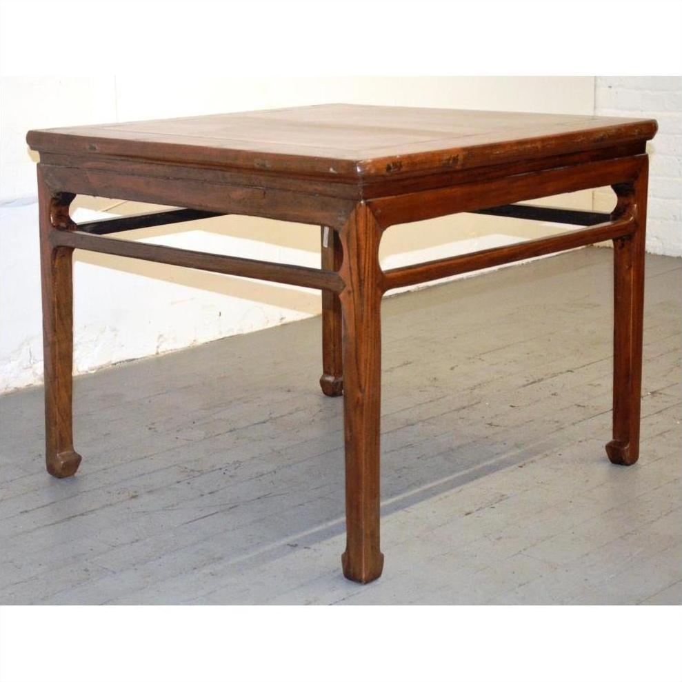 Light wood coffee or side table with simple lines and horsehoof legs, placed on a light wood floor.