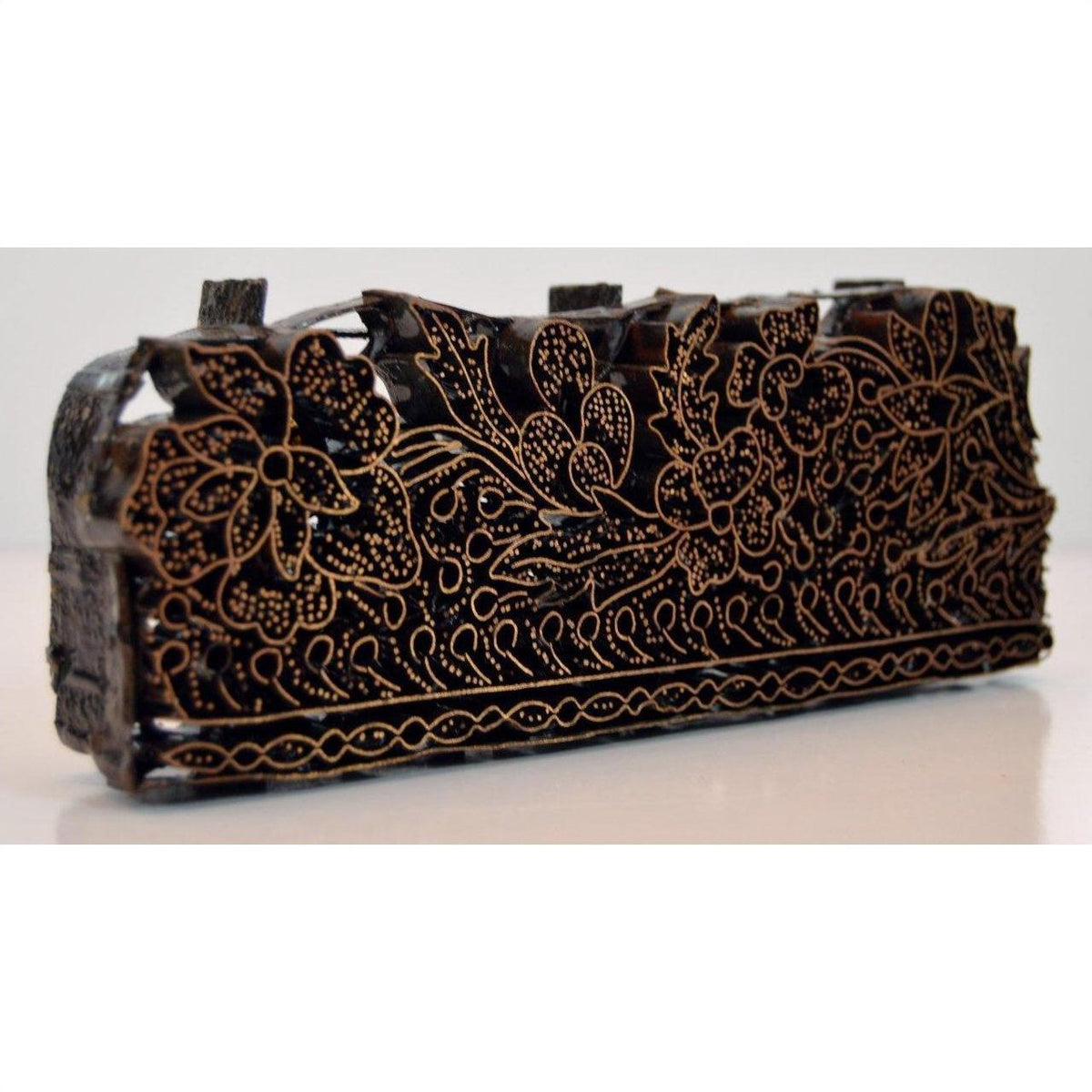 Copper batik ink block, rectangular shape, close-up, for garment making and textile printing.