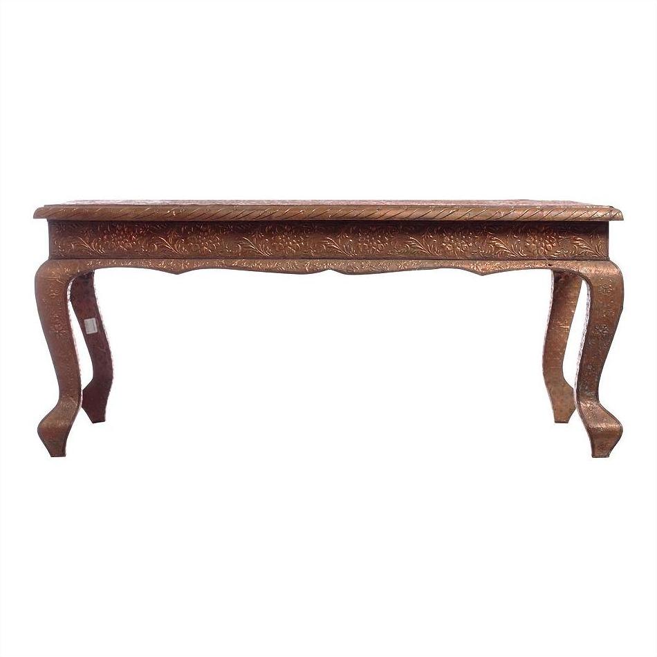 Copper coffee table with curved legs and intricate carvings, displayed against a plain white background.