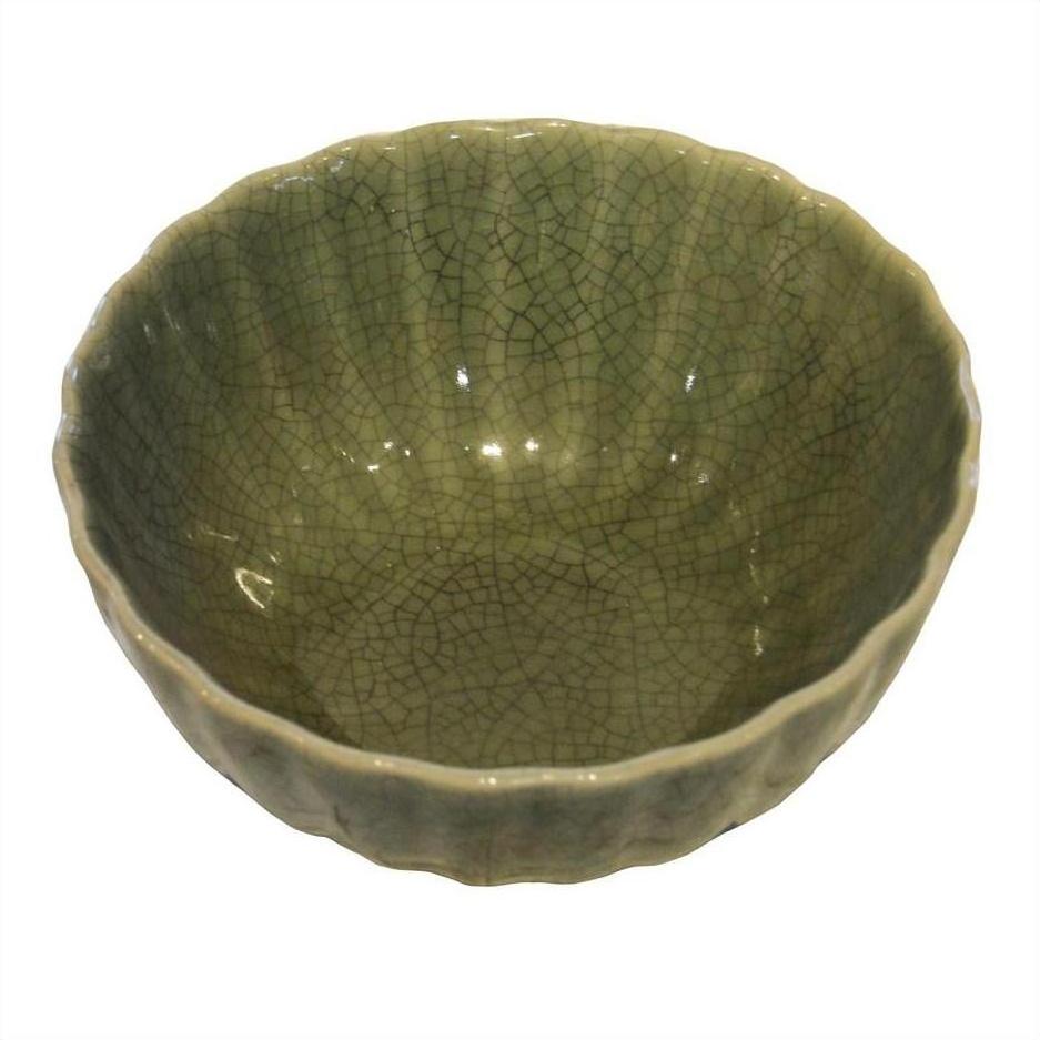 Celadon porcelain bowl with textured crackled glaze and wavy rim, shown on a white background.