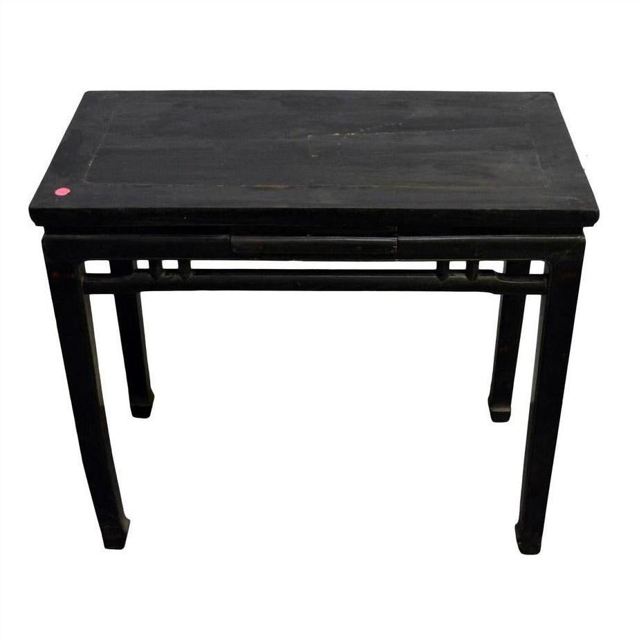Dark stained wood altar table with straight legs, small red dot on top corner, close-up view.
