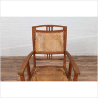 Dutch Colonial Javanese Teak Armchair with Rattan and Triglyph Inspired Motifs