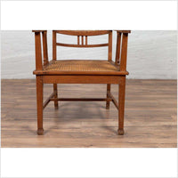 Dutch Colonial Javanese Teak Armchair with Rattan and Triglyph Inspired Motifs