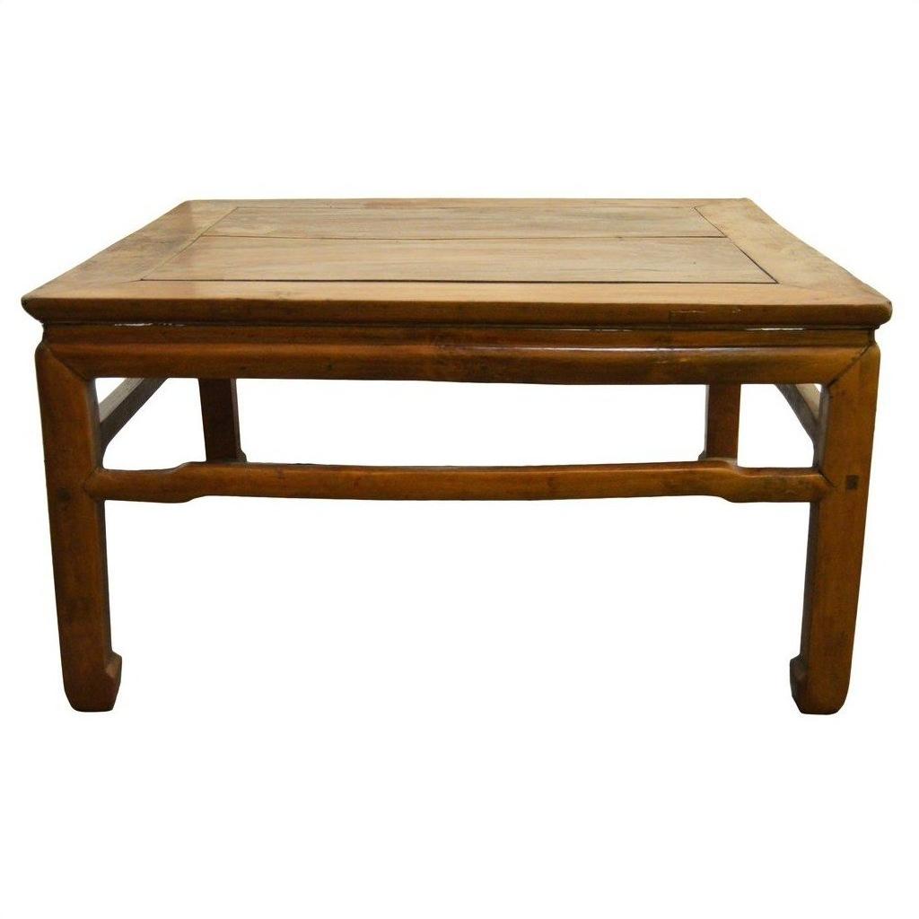 Rectangular elm wood coffee table with sturdy legs, front view, on a white background.