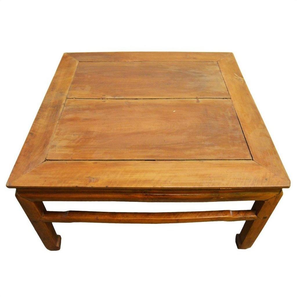 Light elm wood coffee table with refined stretcher and visible grain, 19th-century design.
